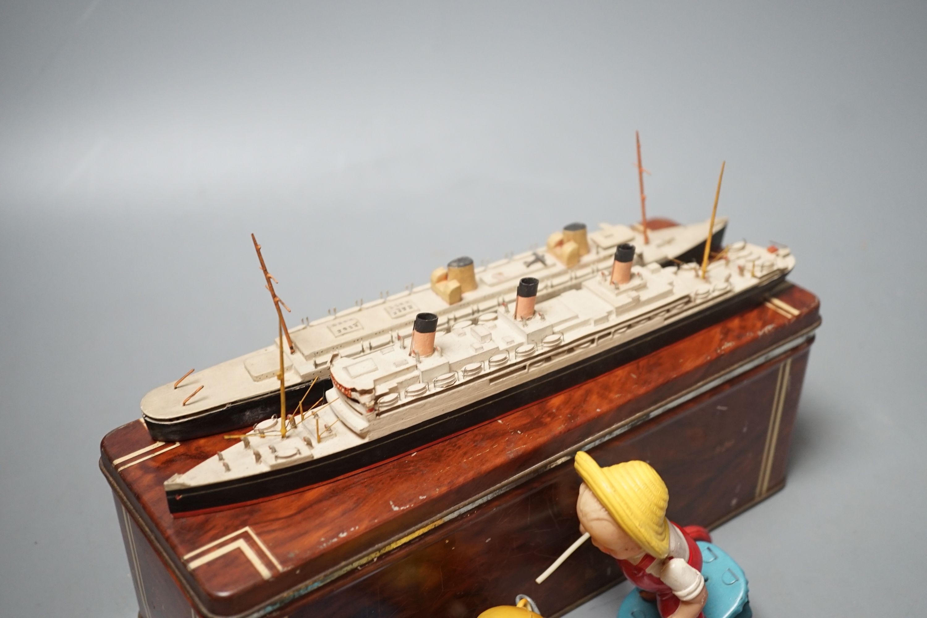 Bassett-Lowke Waterline Model Ships and a Japanned boxed celluloid ‘pig chaser’ toy, 9cms high.